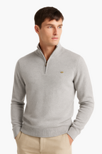 Man wearing a gray sweater with a brand logo on a white background