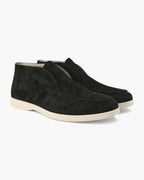 Pair of black suede loafers on a white background