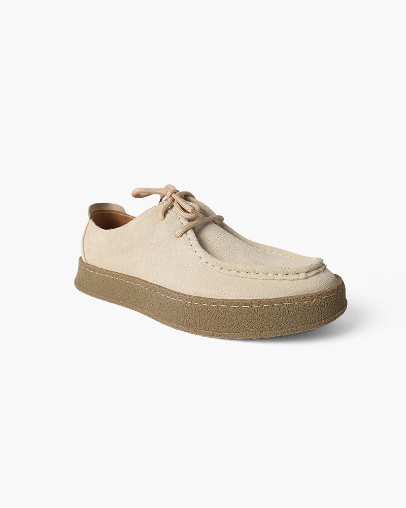 Beige casual shoe on a white background