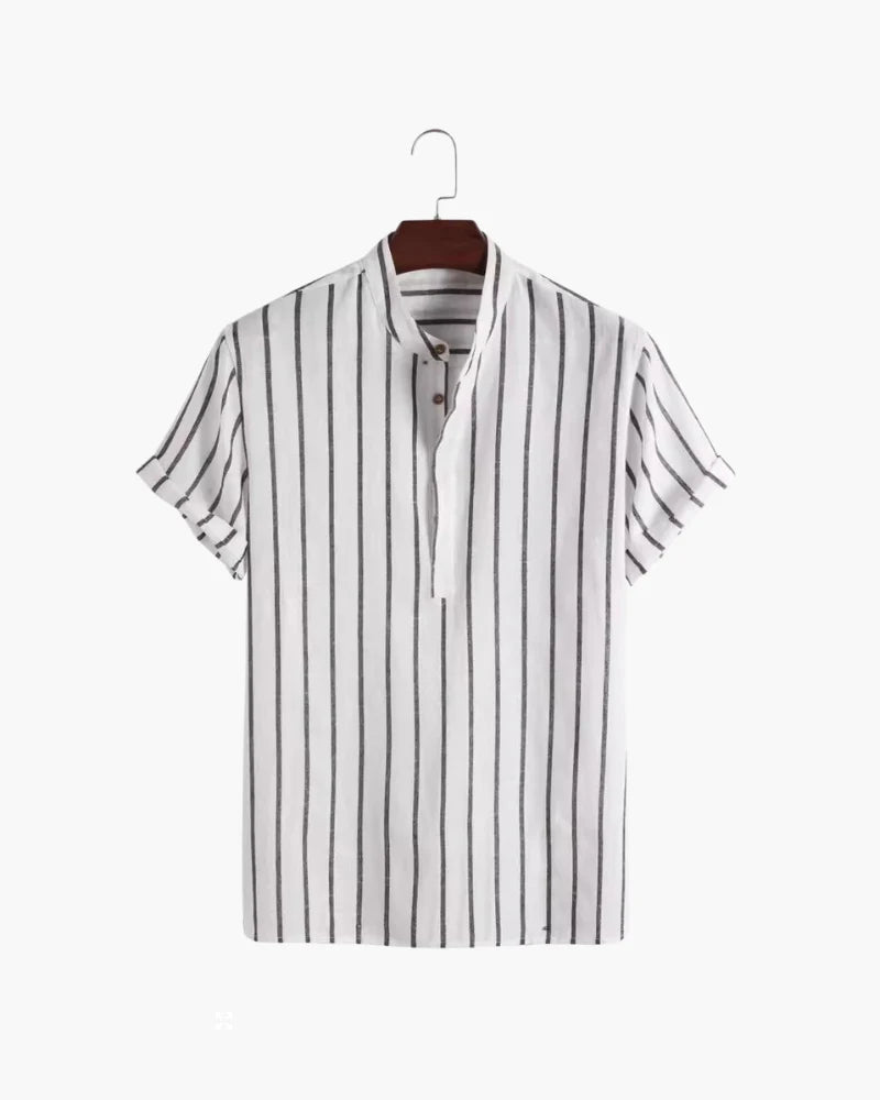 Striped shirt on a hanger against a white background