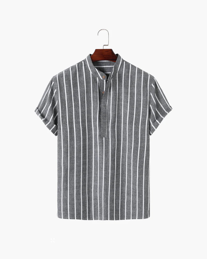 Striped shirt on a hanger against a white background