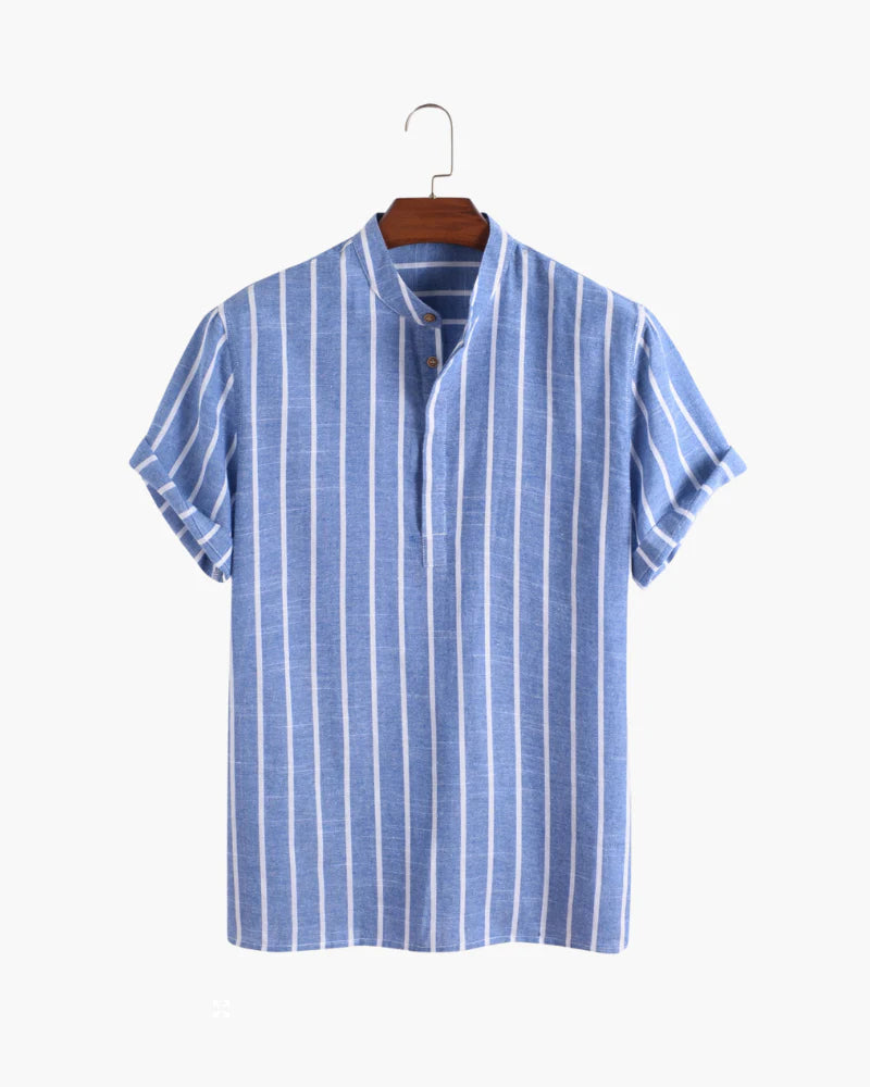 Blue and white striped shirt on a hanger against a white background