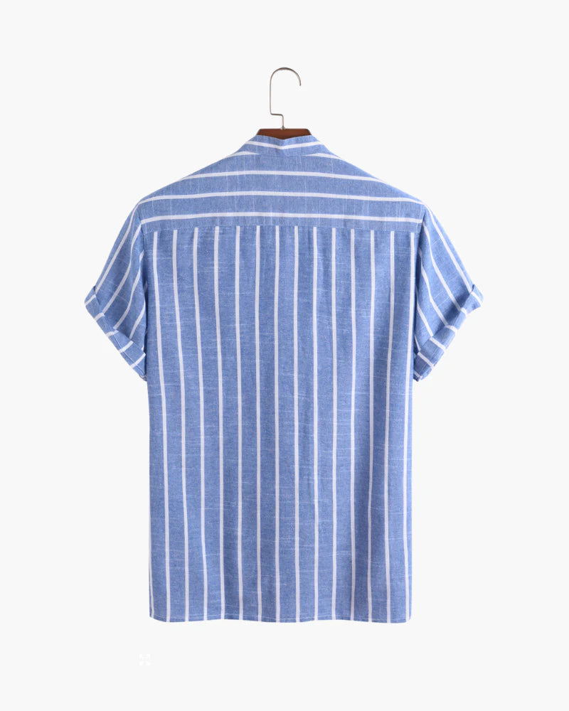 Blue and white striped shirt on a hanger against a white background