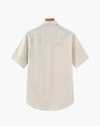 Beige short-sleeve shirt on a white background