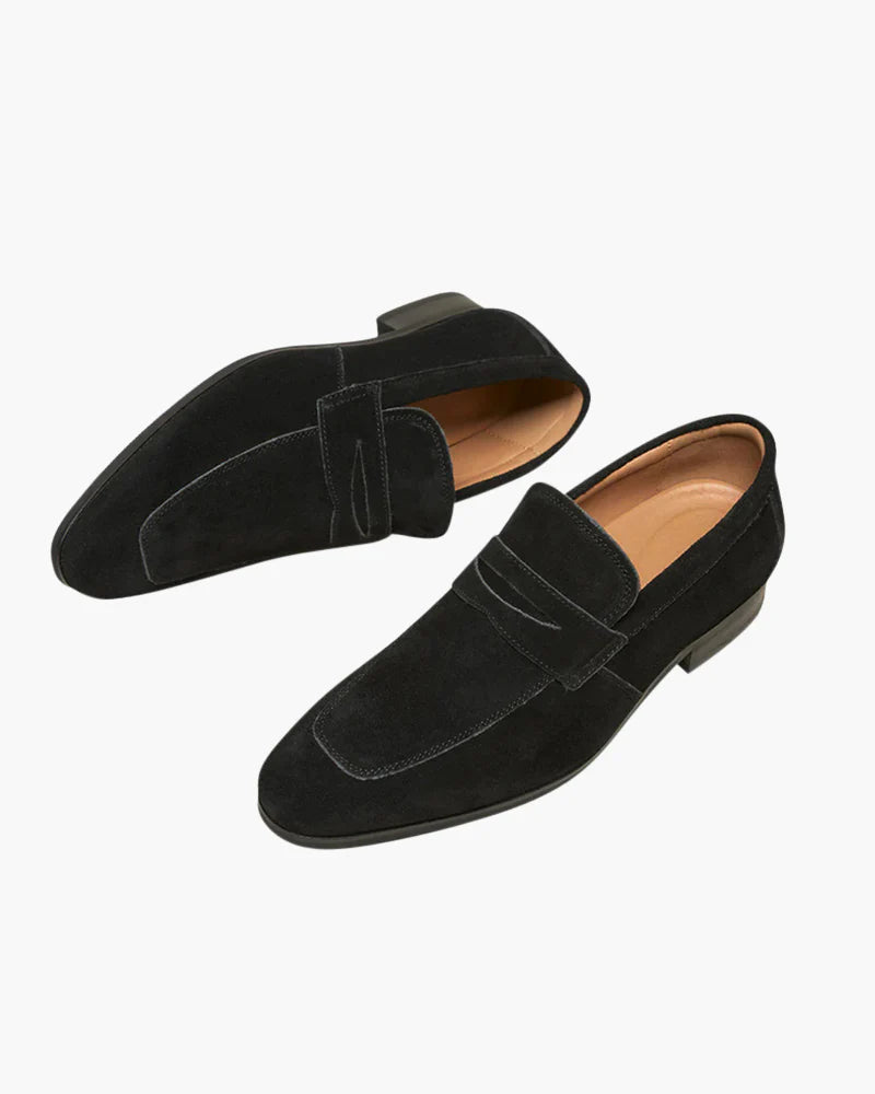 Close-up of the iconic penny keeper strap on the Altivieri suede loafers.