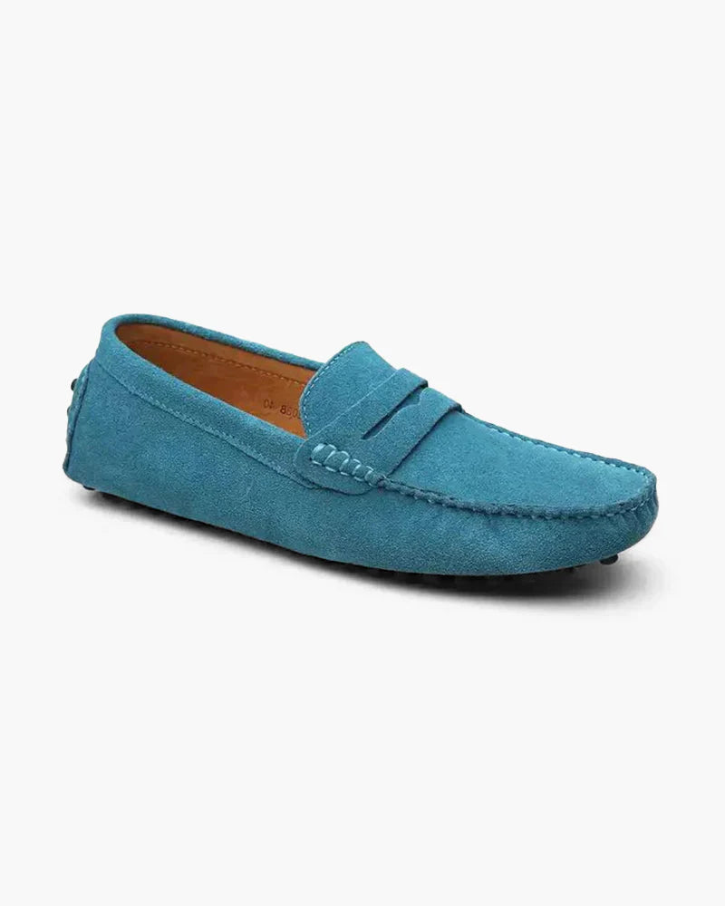 Blue suede loafer shoe on a white background