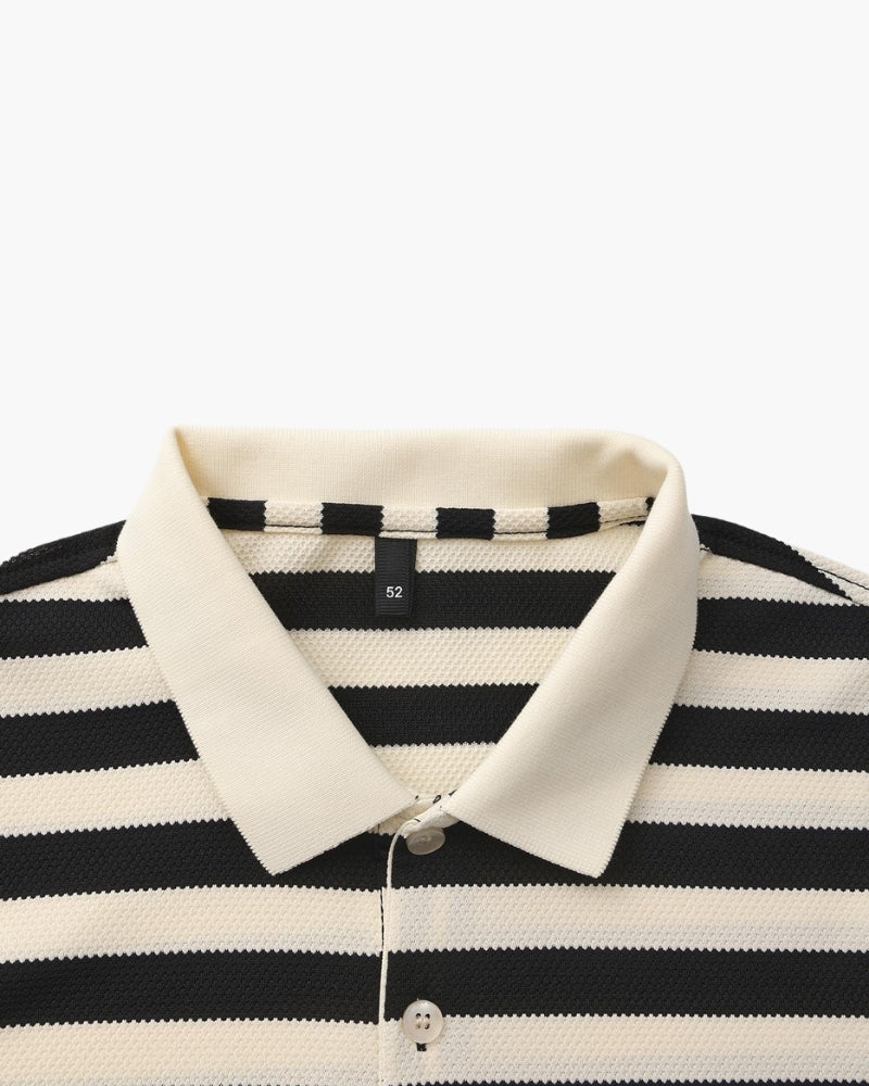 Black and white striped polo shirt with a collar on a white background