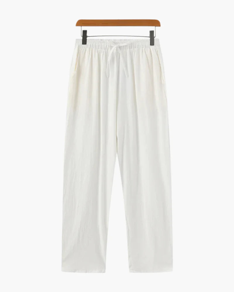 White pants on a hanger against a white background