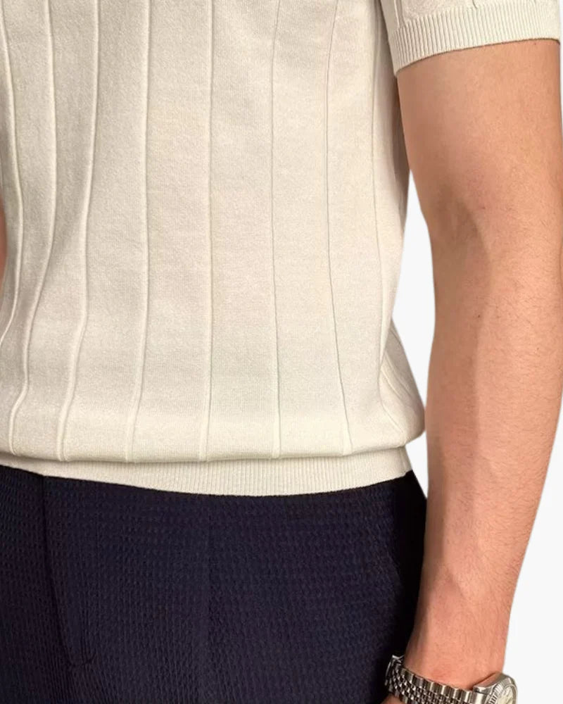Close-up of the premium ribbed cotton texture on the Cannes polo shirt.