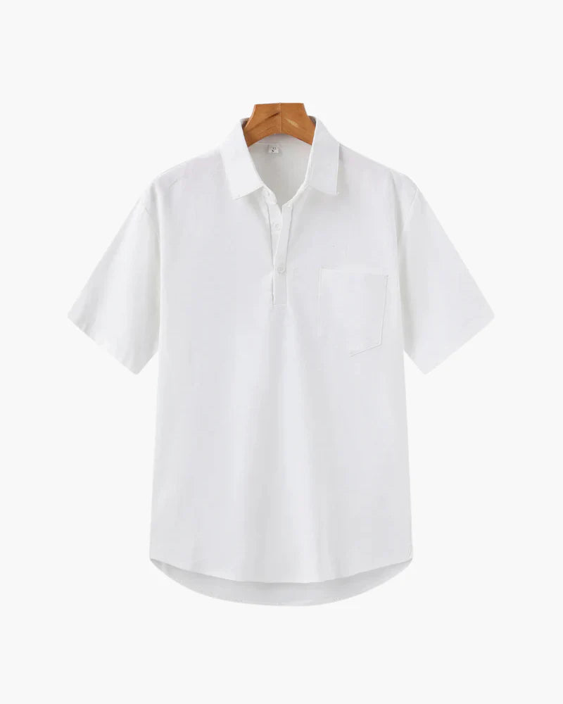 White shirt on a wooden hanger against a white background