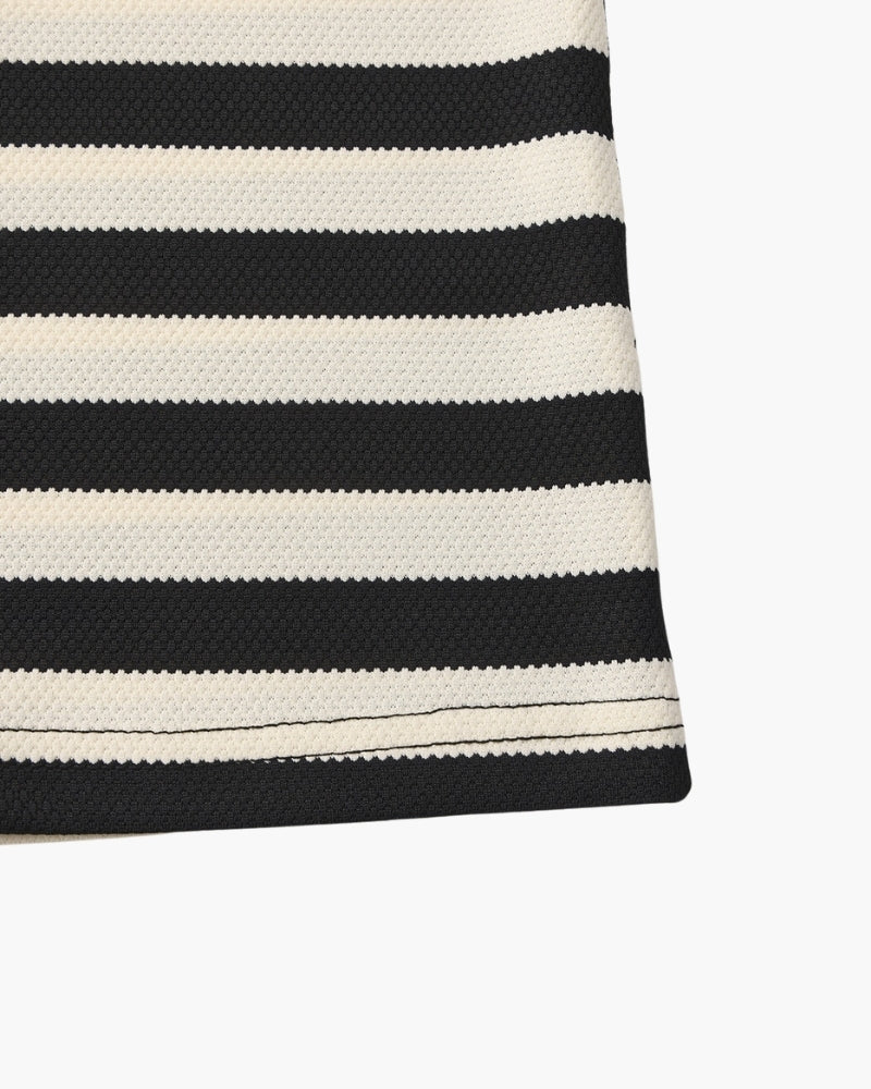 Close-up of a black and white striped fabric on a white background