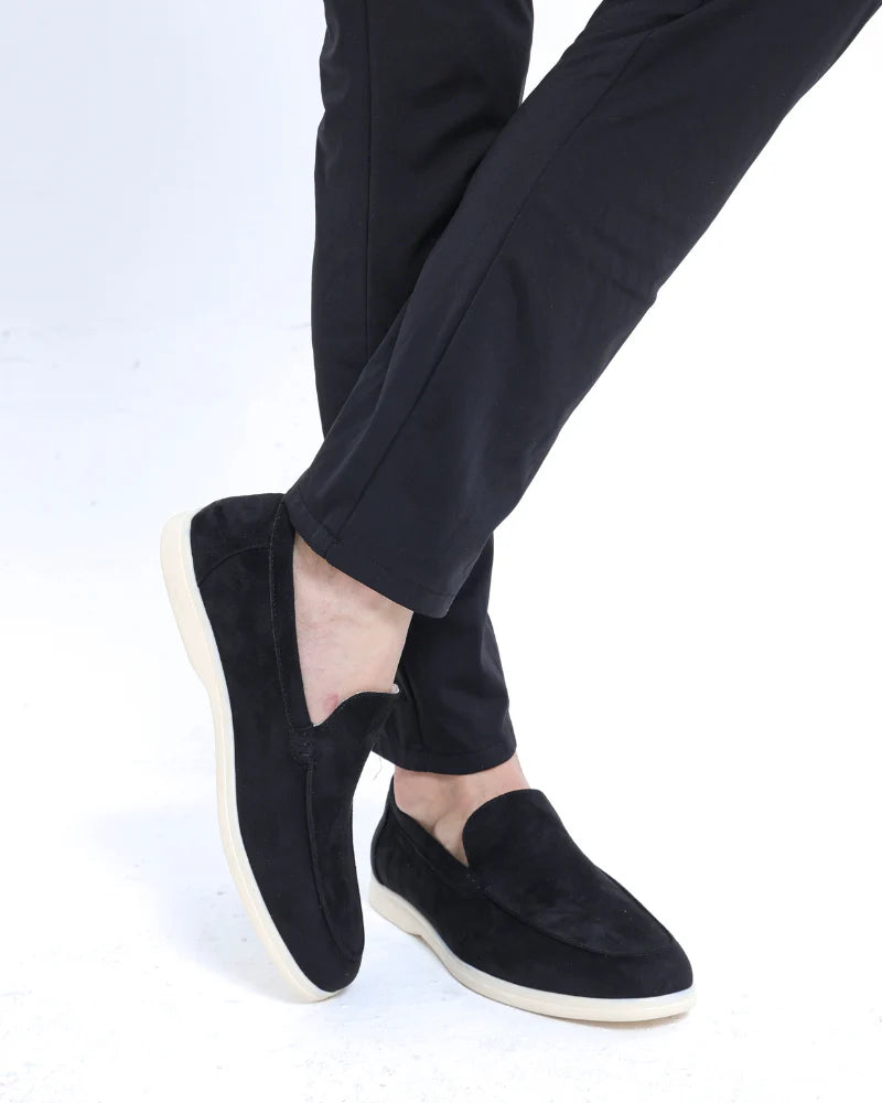 Man wearing suede loafers with trousers.