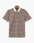 Brown and white striped polo shirt on a hanger against a white background