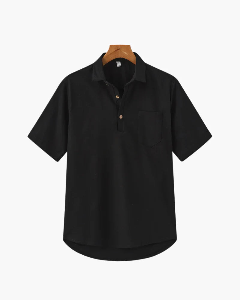 Black short-sleeve shirt on a hanger against a white background