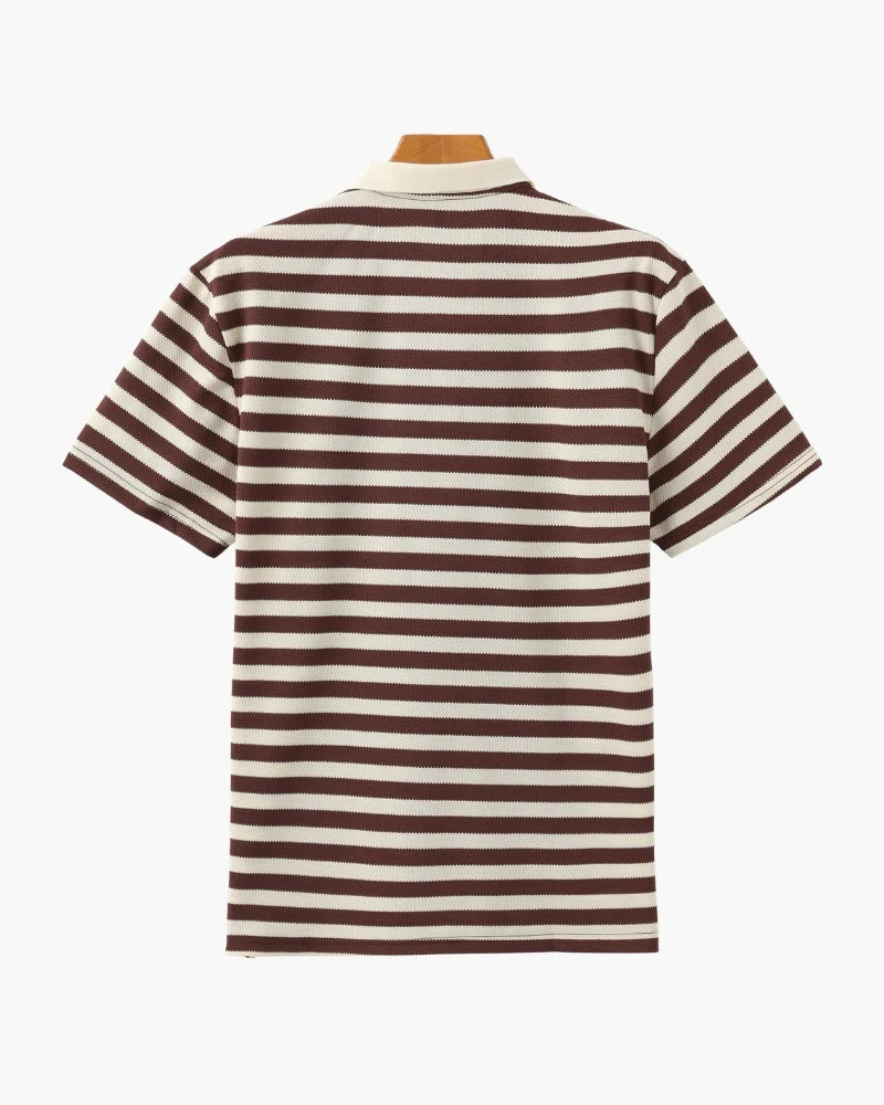 Brown and white striped polo shirt on a hanger against a white background
