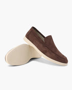 Brown suede loafer shoe on a white background