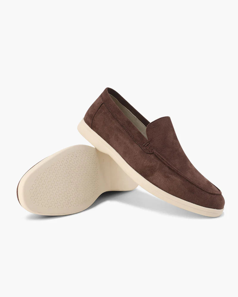 Brown suede loafer shoe on a white background