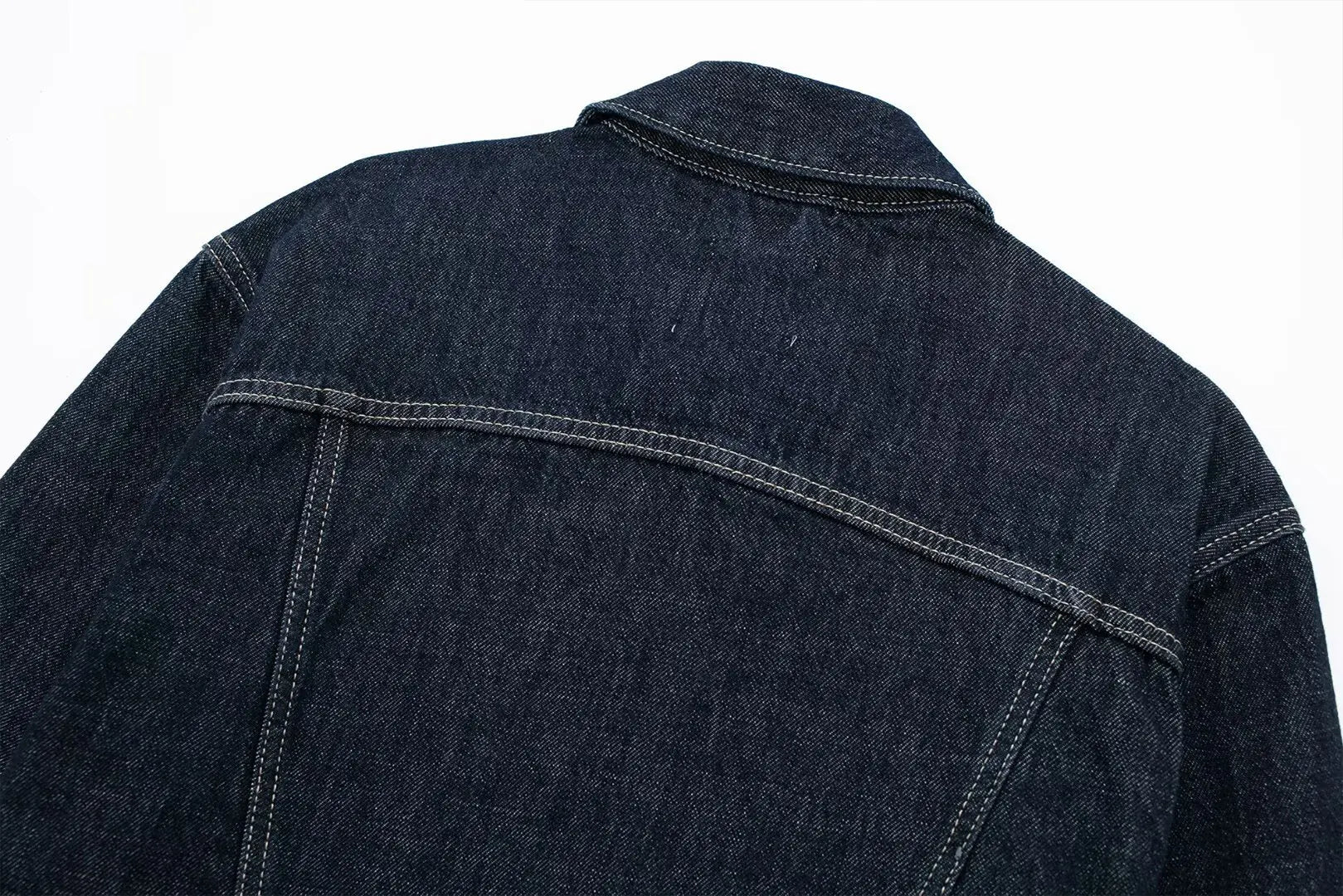 Dark blue denim jacket on a white background
