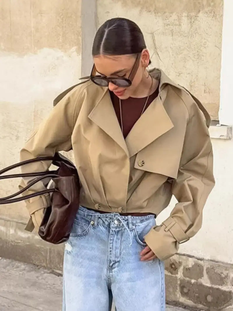 Woman wearing the Altivieri 'The Londoner' khaki cropped trench coat.