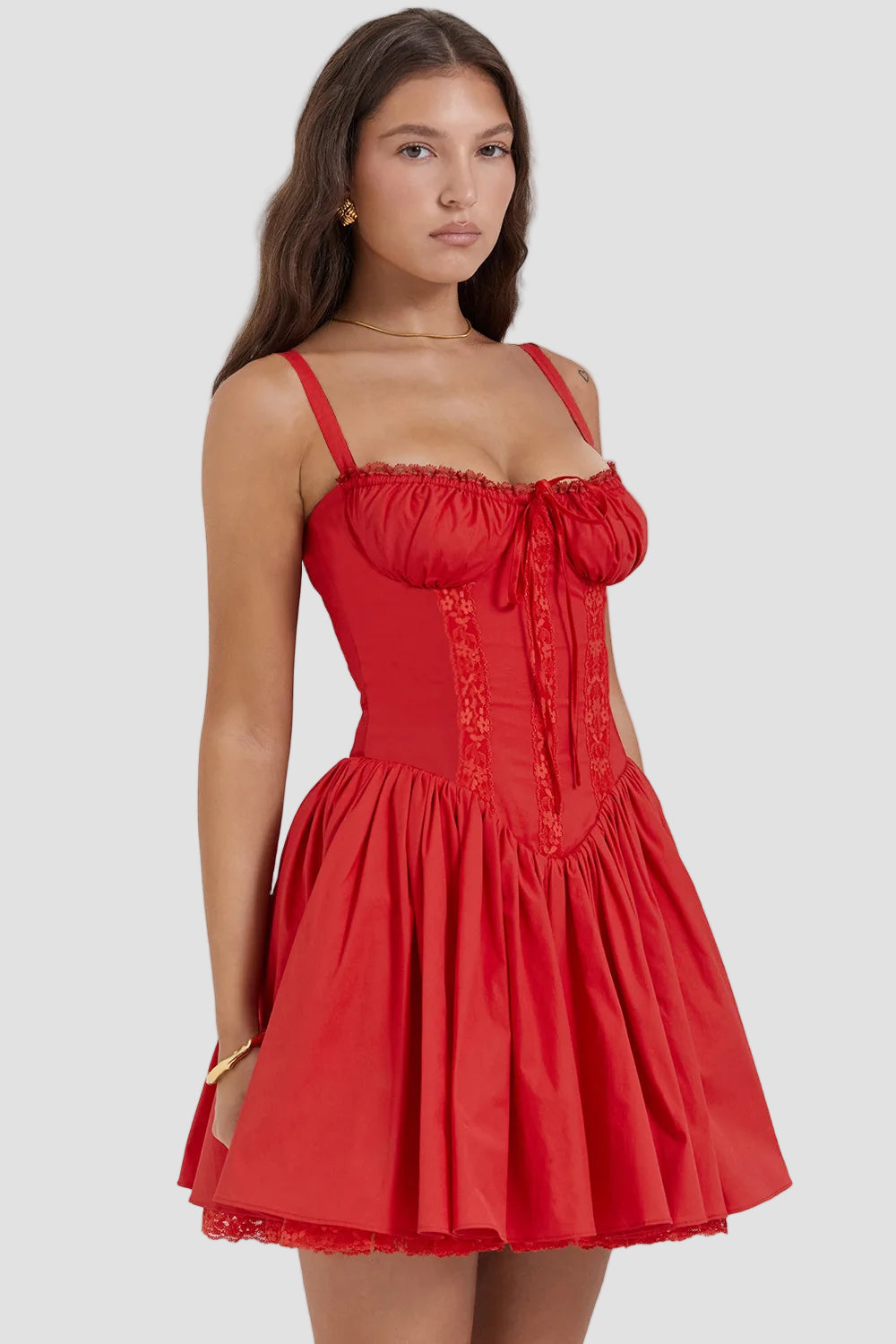 Red dress worn by a model on a white background