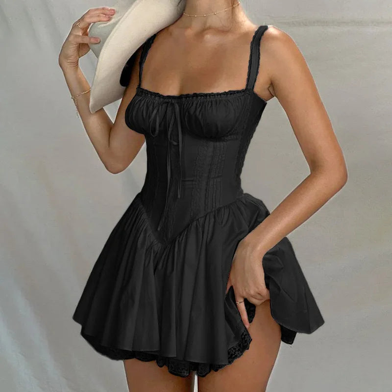 Black dress worn by a person on a plain background