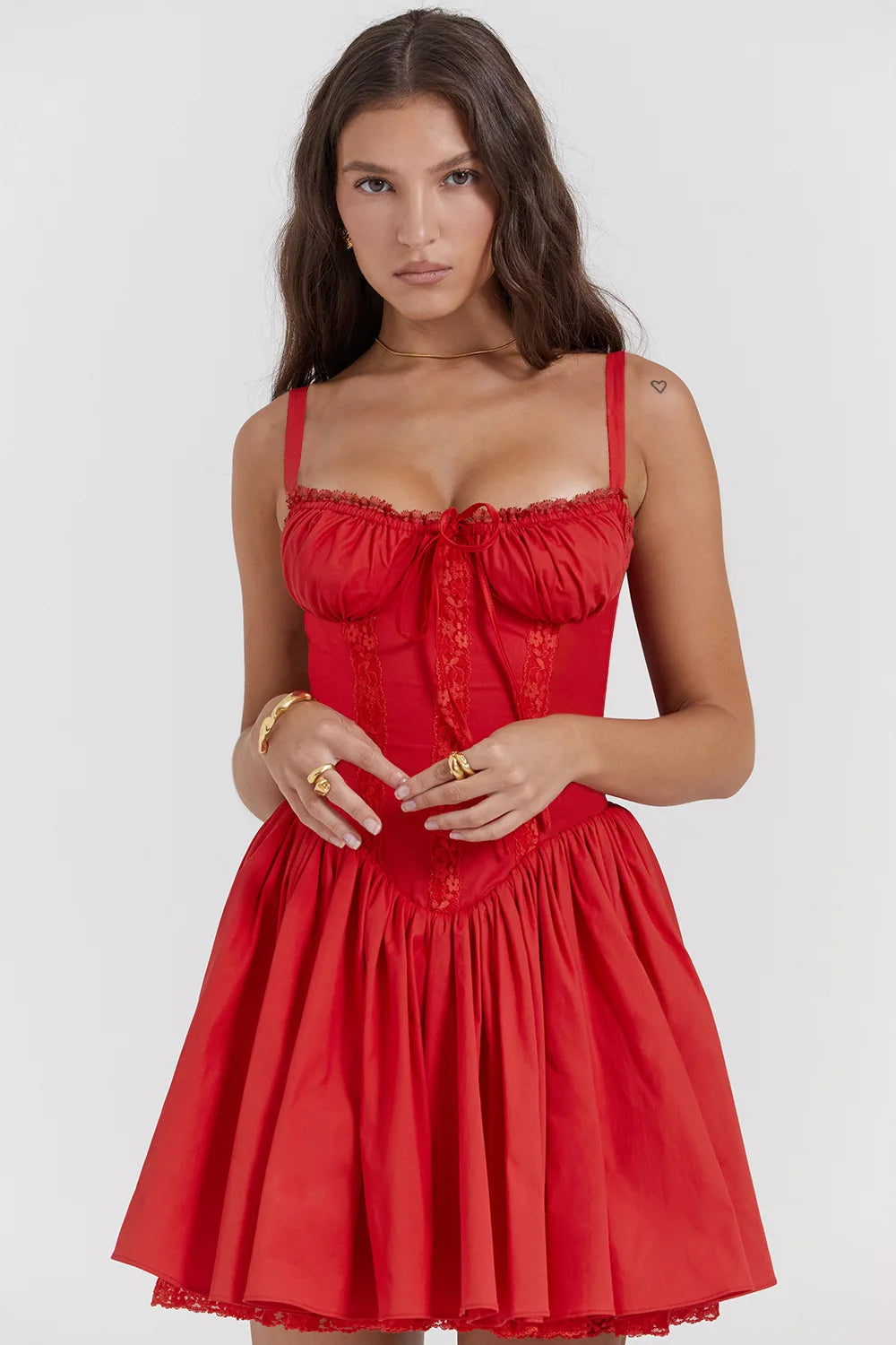Woman wearing a red dress against a white background