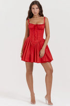 Woman wearing a red dress on a white background