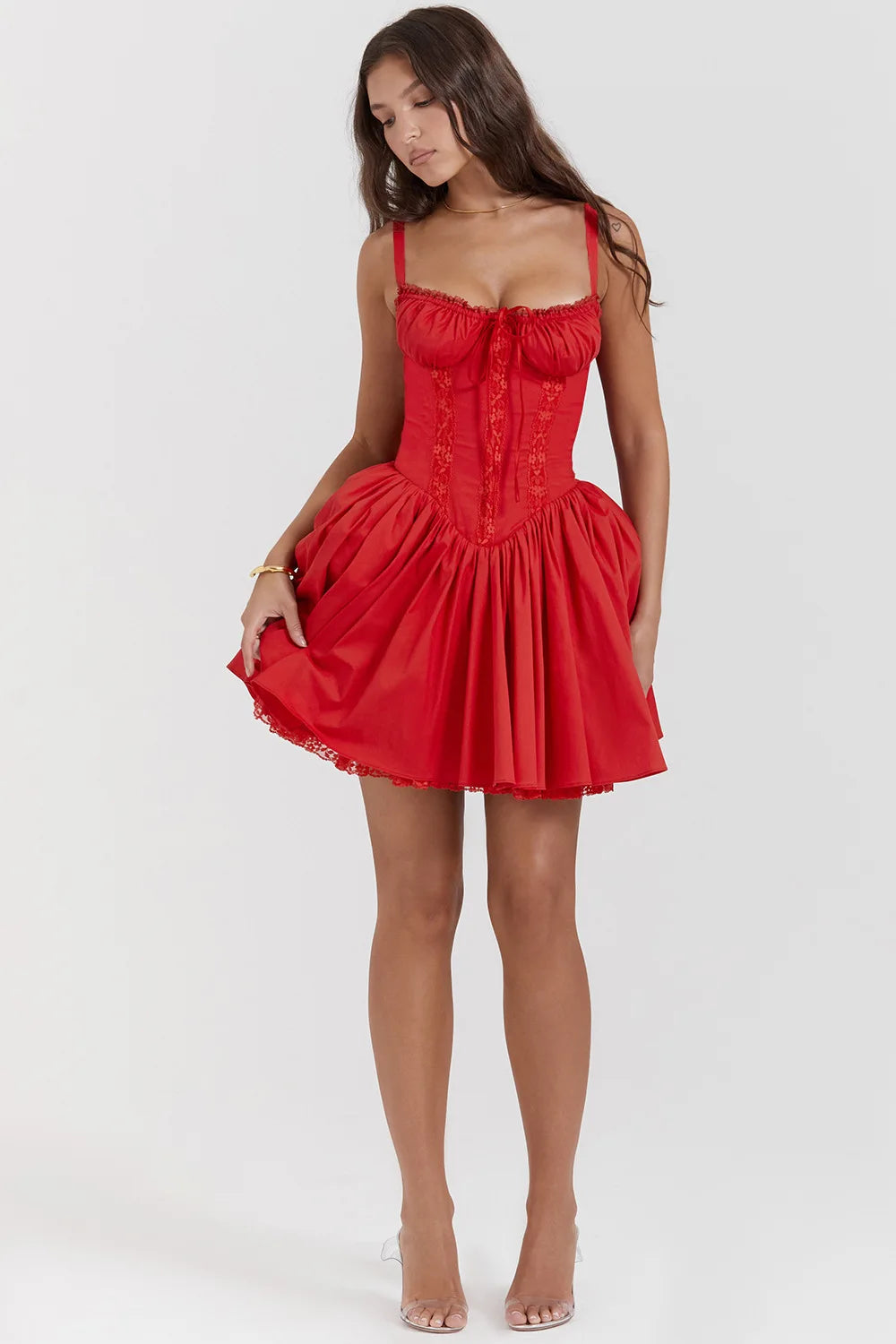 Red dress worn by a model on a white background