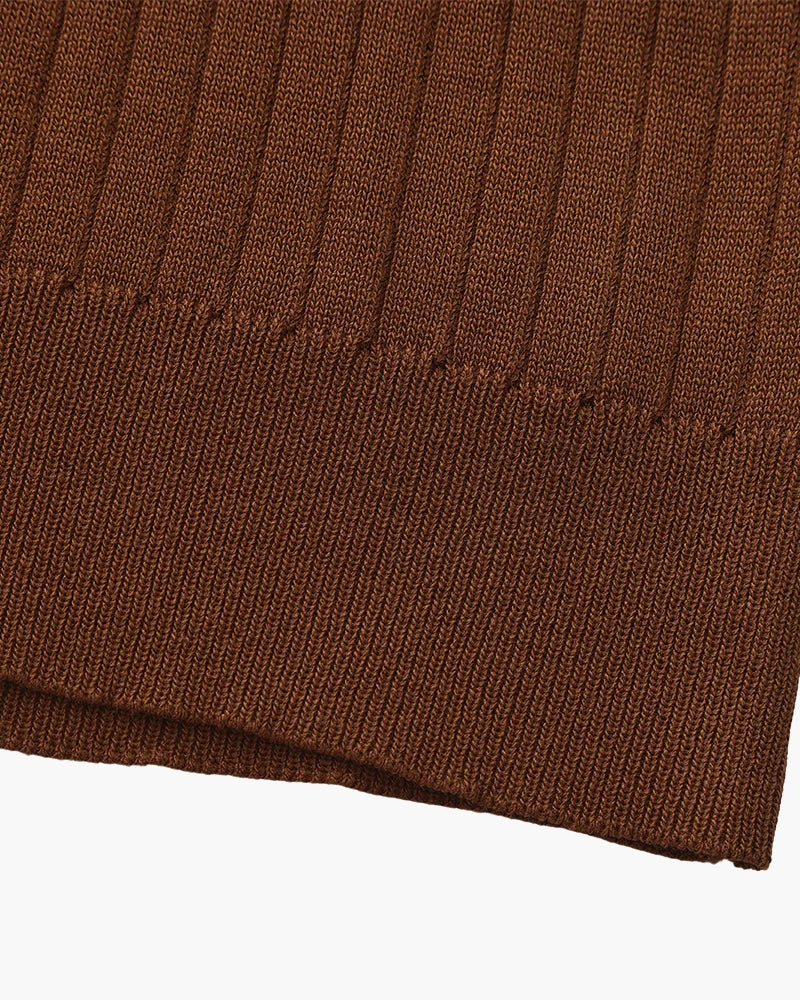Close-up of the textured ribbed fabric on the Altivieri knit polo.