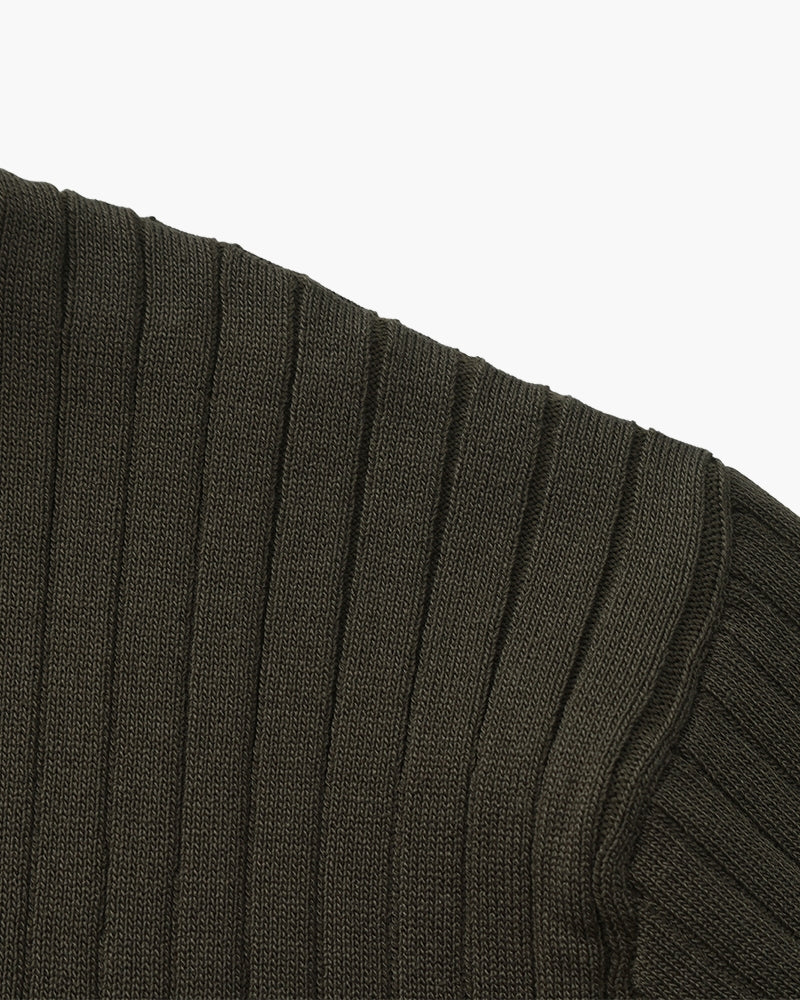 Close-up of the textured ribbed fabric on the Altivieri knit polo.