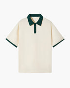 Beige polo shirt with green accents on a white background
