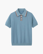 Blue ribbed knit polo shirt with striped collar on a white background