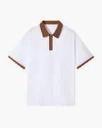White polo shirt with brown accents on a white background
