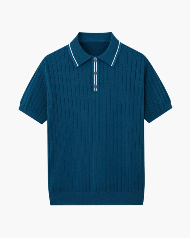 Blue ribbed polo shirt with white trim on a light gray background