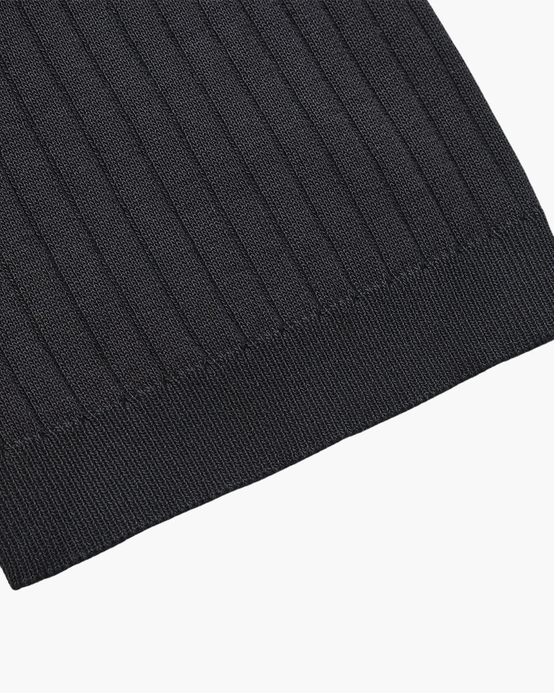 Close-up of the textured ribbed fabric on the Altivieri knit polo.