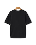 Back profile of the Riviera ribbed polo shirt showing its classic fit.