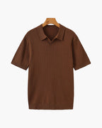 Brown ribbed polo shirt on a hanger against a white background