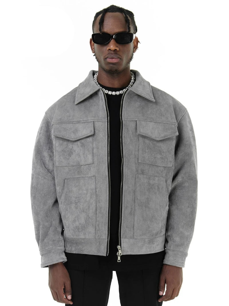 Man wearing a gray jacket with a white background