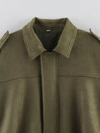 Green suede jacket with a plain background