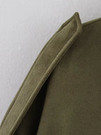 Close-up of a green fabric texture on a white background