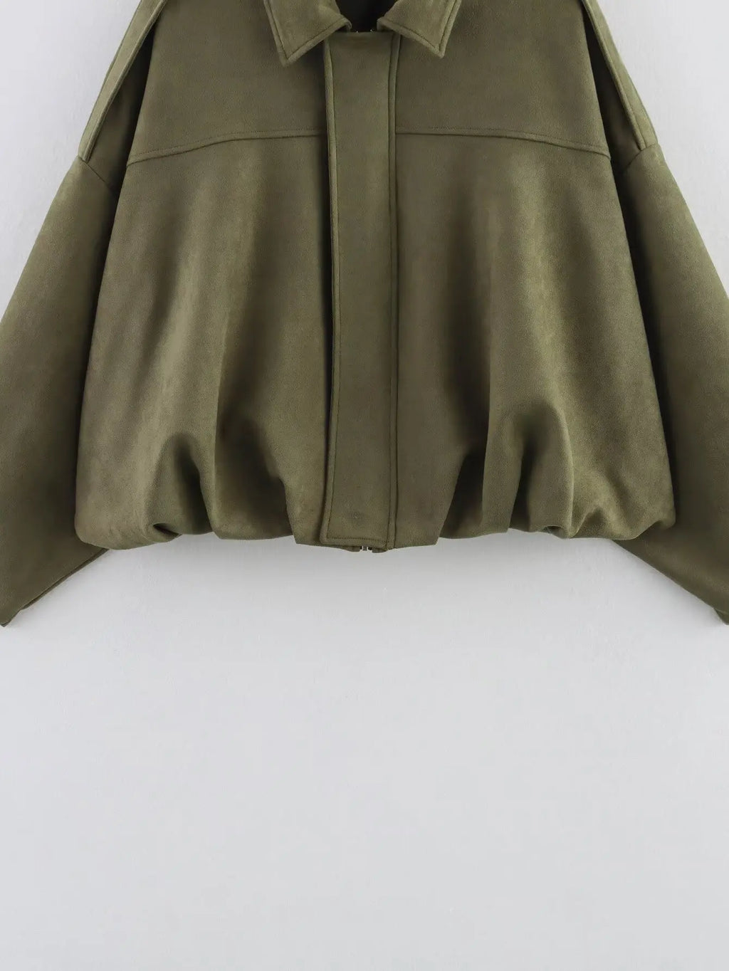 Green cape on a white background