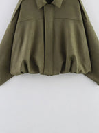 Green cape on a white background