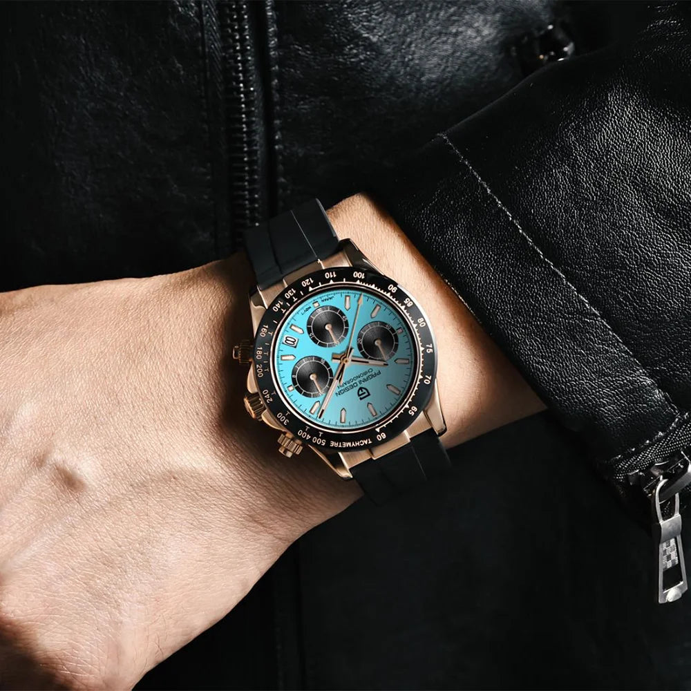 Luxury watch with blue face and rose gold case on a wrist, against a dark background.