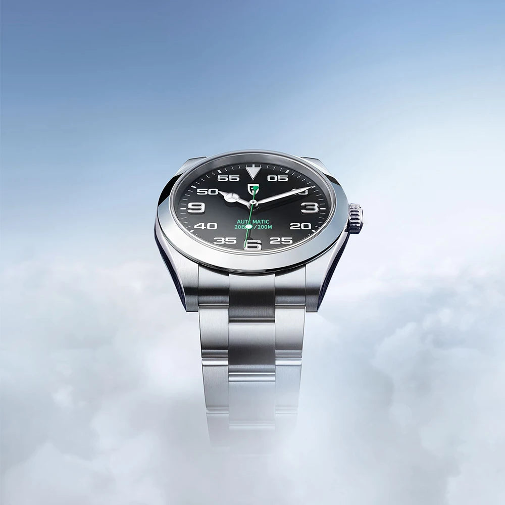 Silver watch with a black dial on a light blue gradient background