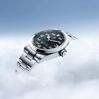Silver smartwatch with a black display on a light blue gradient background