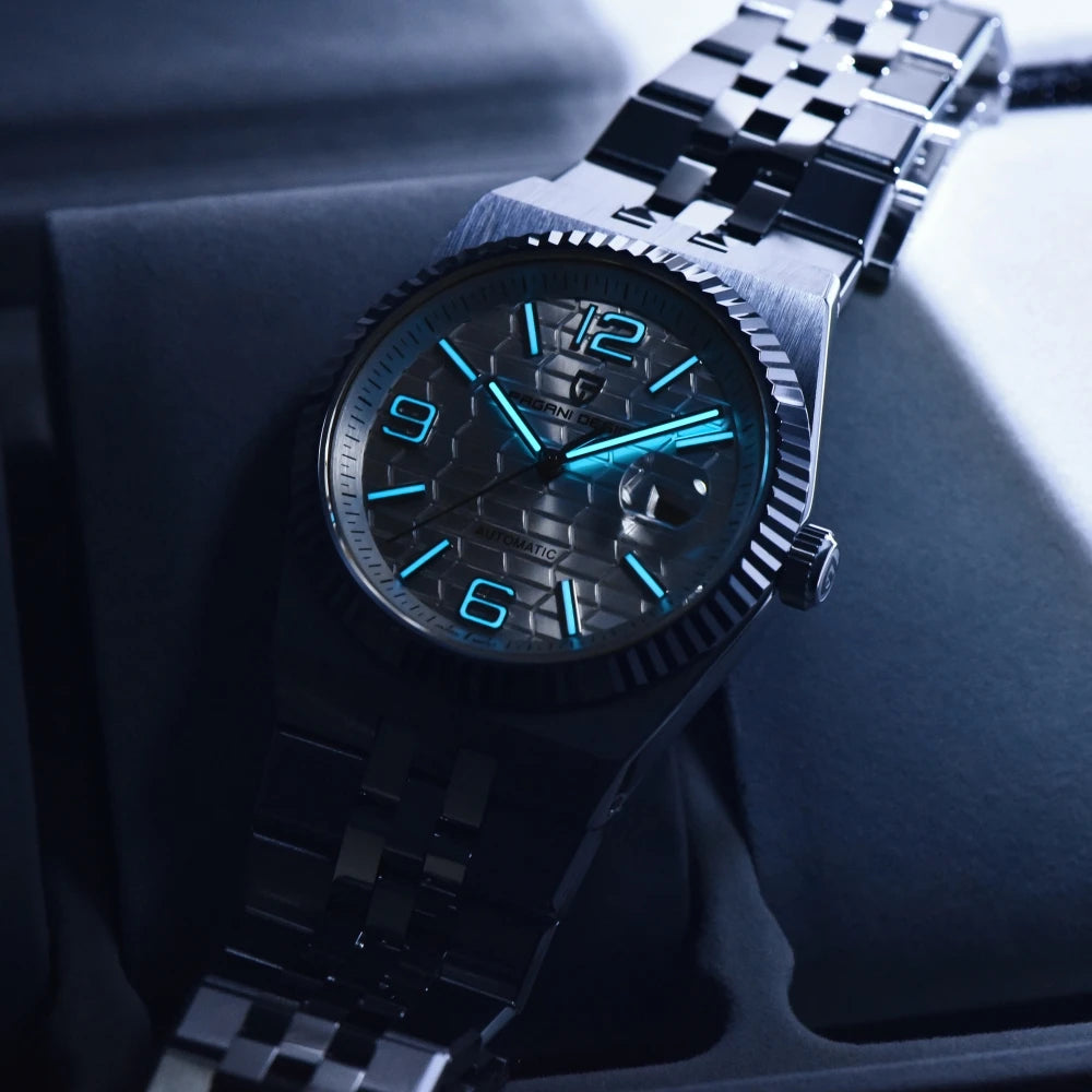 Close-up of a black wristwatch with blue accents on a dark background