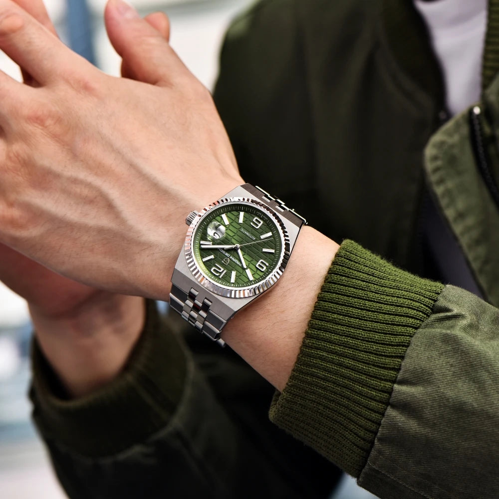 Person wearing a green watch with a blurred background