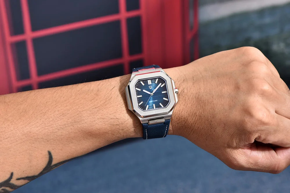 Person wearing a blue watch with a red and black background