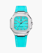 Turquoise watch with silver case and detailed face on a white background, featuring Pagani Design branding.
