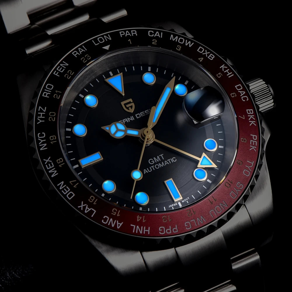 Luxury watch with black face and red bezel on a dark background